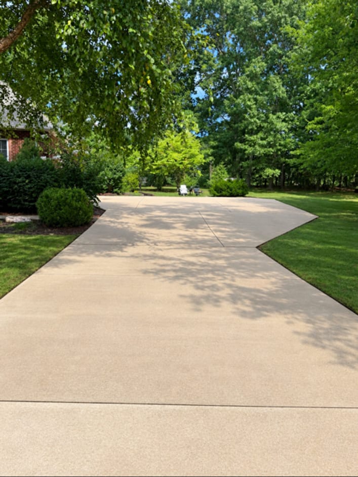 The same driveway after washing, back to a clean tan finish from the road to the turnaround
