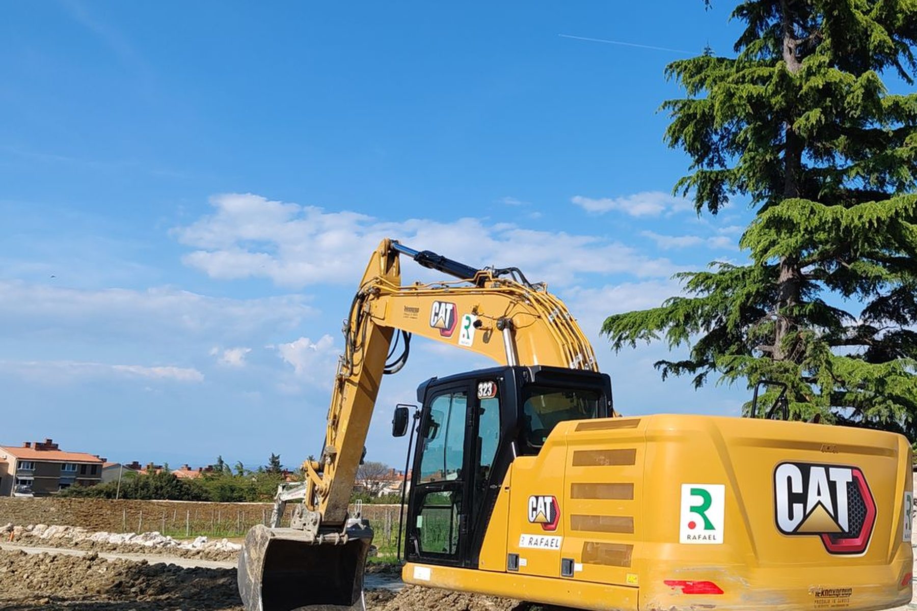 A tracked excavator parked on a jobsite